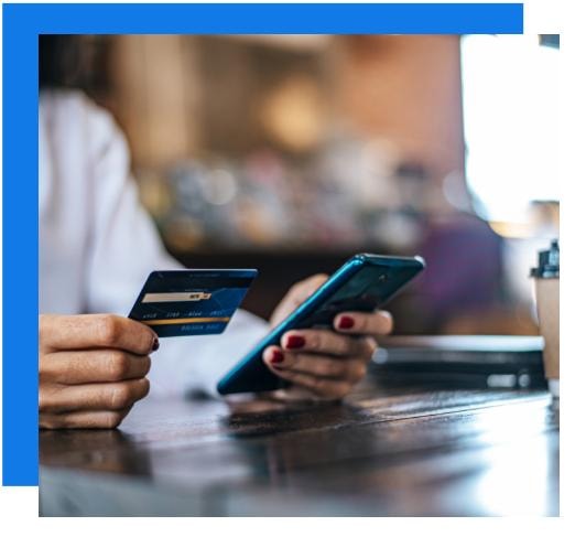 Person making an online payment with credit card and smartphone